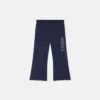 Pantaloni de trening evazați pentru copii, cu logo Versace strălucitor Pantaloni de trening evazați pentru copii, cu logo Versace strălucitor