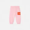 Pantaloni de trening pentru copii cu logo vintage din anii ’90 Pantaloni de trening pentru copii cu logo vintage din anii ’90